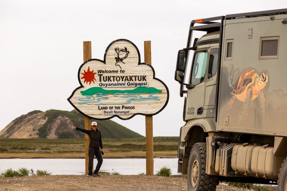 Tuktoyaktuk welcome sign with Steffen and Tortuga