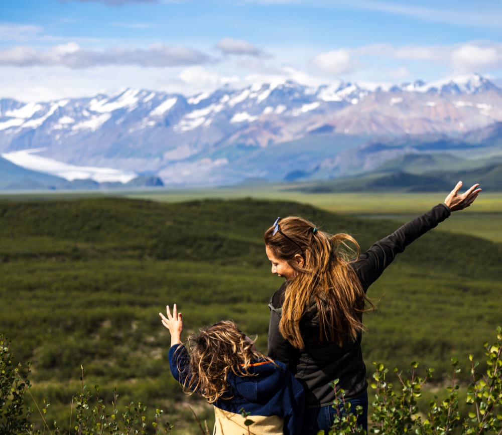 Ana and Lilli with mountains behind