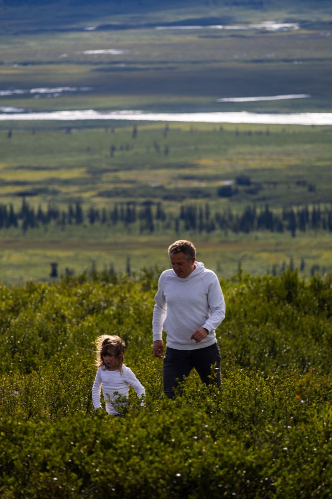Steffen and Lilli walking through tundra